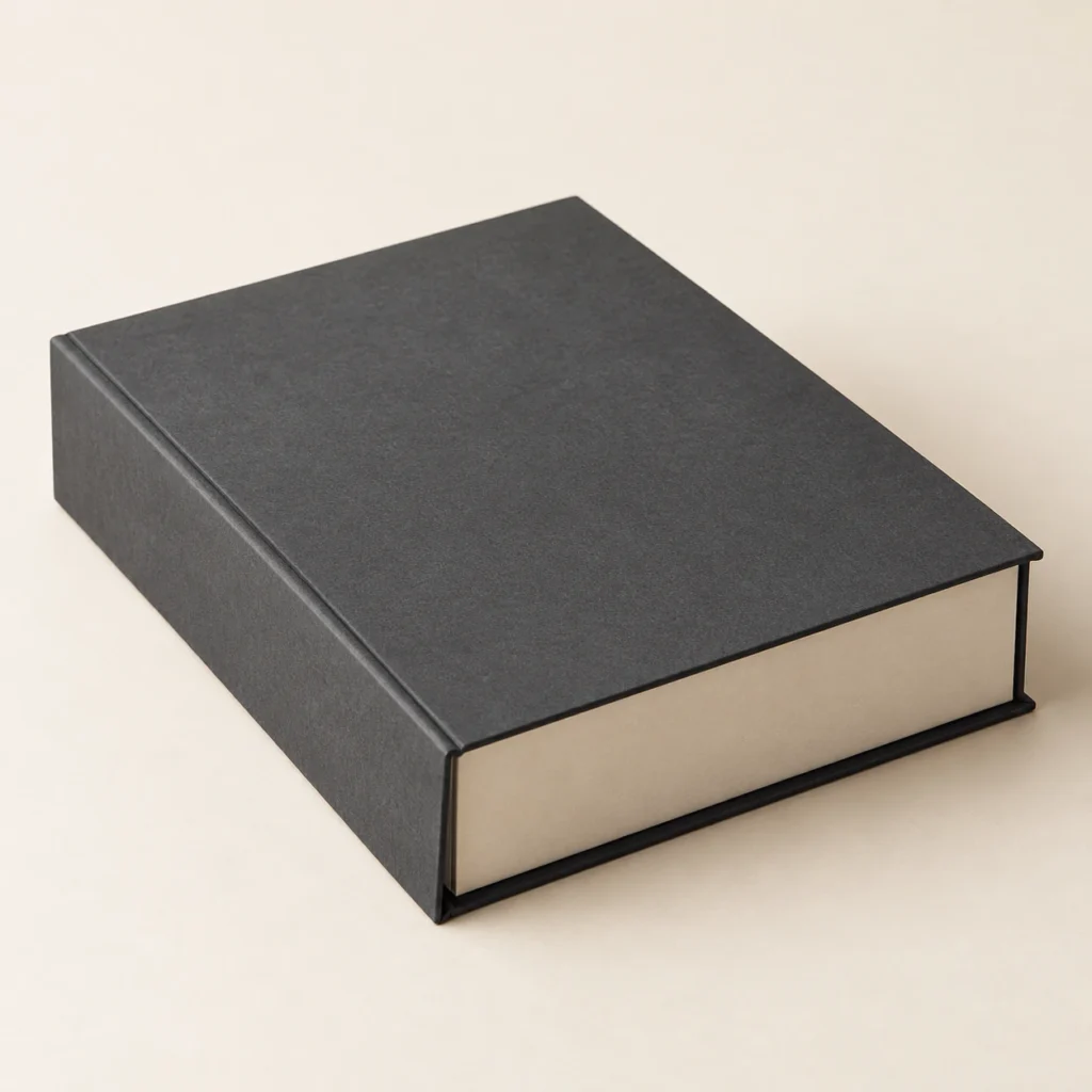 AI concept: charcoal book-shaped presentation box with an ivory interior, catalog view.