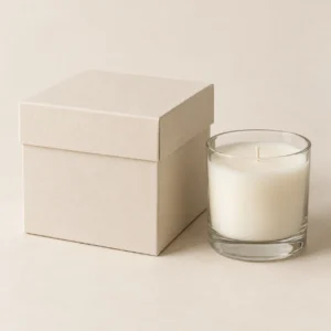 AI concept: ivory candle gift box with a clear glass jar candle, catalog view.