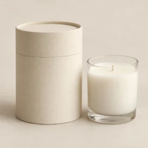 AI concept: ivory cylindrical candle pack with a round lid and a glass candle jar, catalog view.