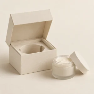 AI concept: ivory cosmetic box with a circular jar opening in the fitment, catalog view.