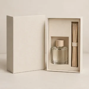 AI concept: ivory diffuser pack with fitted bottle and reed compartments, catalog view.