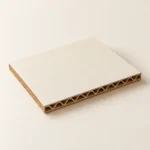 AI concept: a smooth ivory-faced laminated corrugated panel with an exposed brown fluted edge.