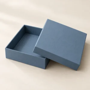 AI concept: a dusty blue matte rigid box with an open base and matching lid.
